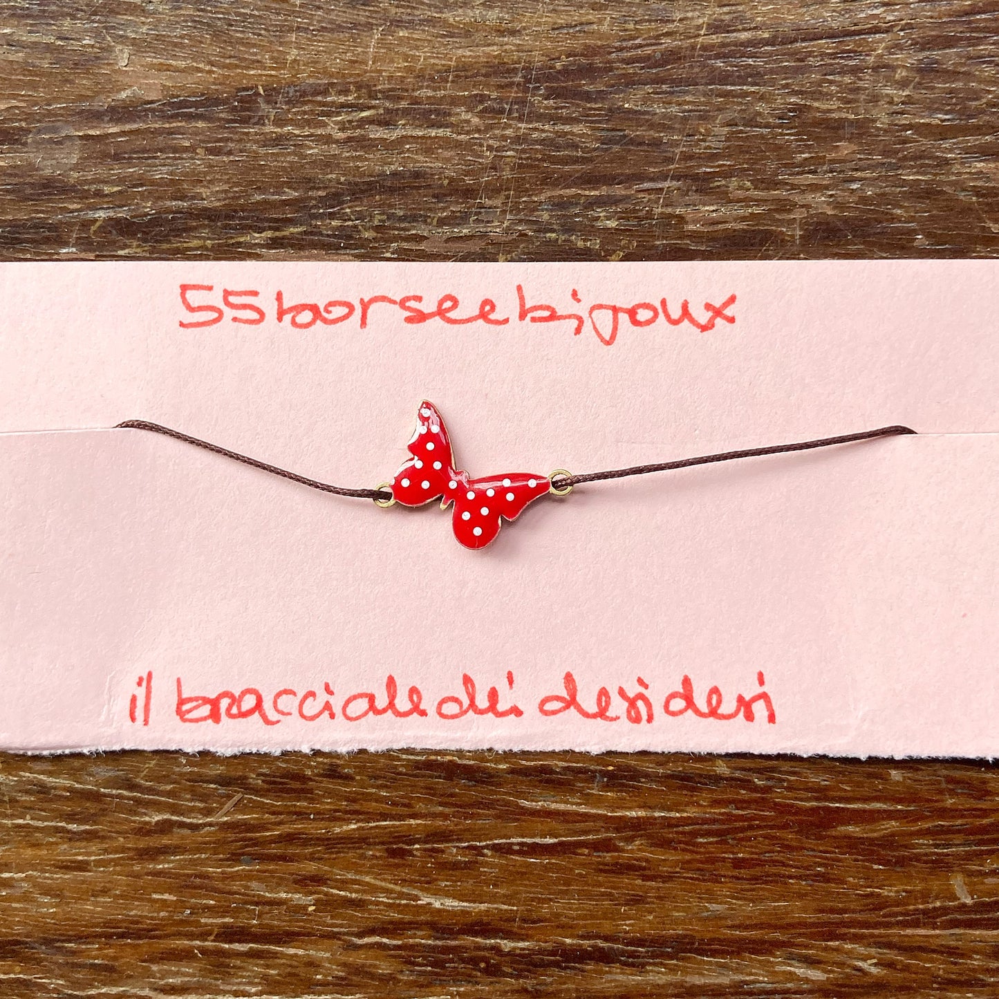 Farfallina rossa a pois bianchi